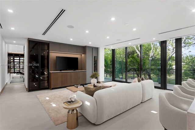 3571 Fair Isle St, Miami, FL 33133 - living room featuring a wall of windows and recessed lighting