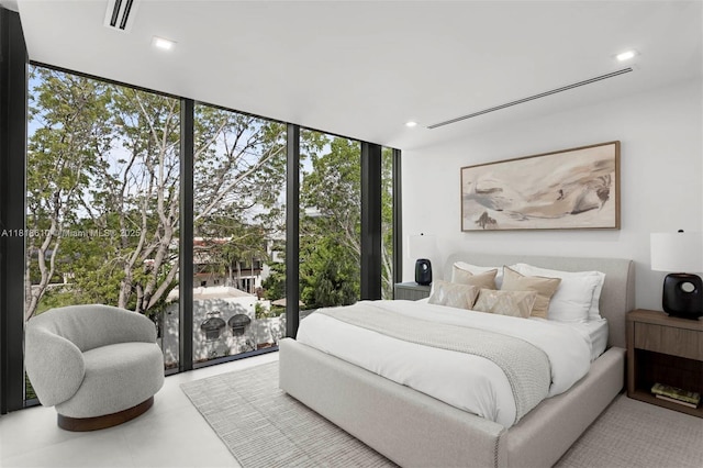 3571 Fair Isle St, Miami, FL 33133 - bedroom featuring a wall of windows and recessed lighting