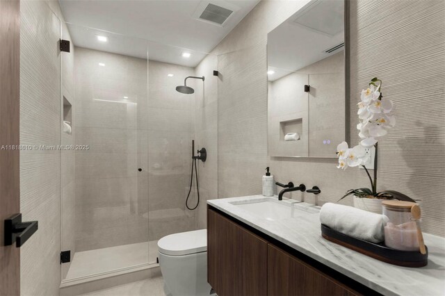 3571 Fair Isle St, Miami, FL 33133 - full bathroom featuring a shower stall, vanity, and tile walls