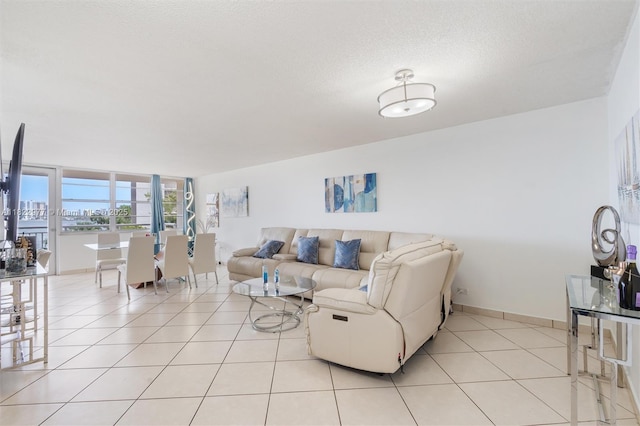 251 174th St Unit 218, Sunny Isles Beach, FL 33160 - living room featuring light tile patterned floors and baseboards