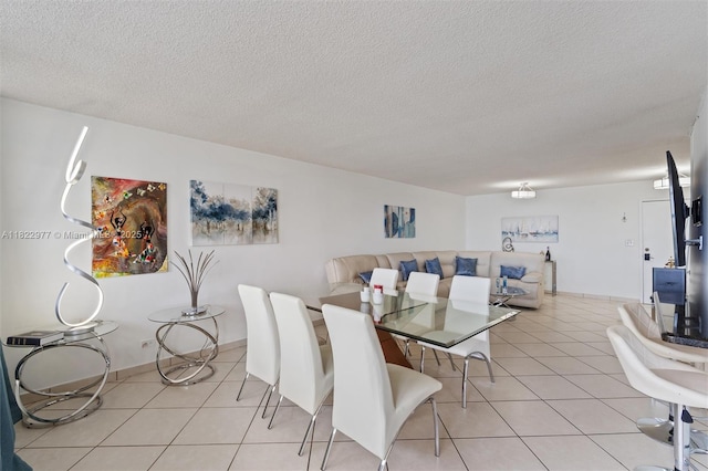 251 174th St Unit 218, Sunny Isles Beach, FL 33160 - dining room with a textured ceiling and light tile patterned floors
