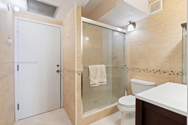 251 174th St Unit 218, Sunny Isles Beach, FL 33160 - full bath with tile walls, tile patterned floors, vanity, and a shower stall