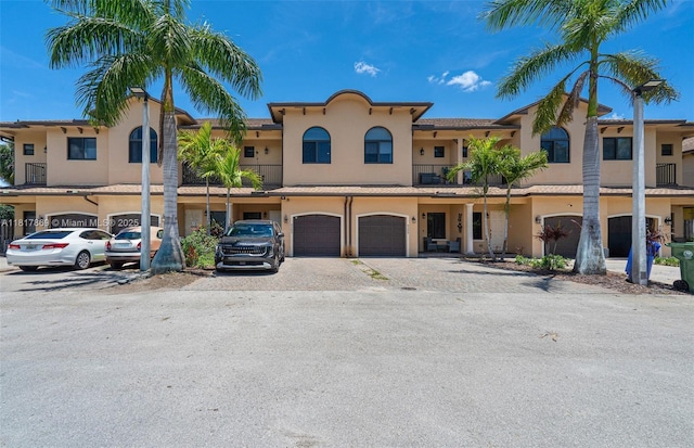 9265 NW 16th St, Pembroke Pines, FL 33024 - view of front of house with stucco siding, a garage, and driveway