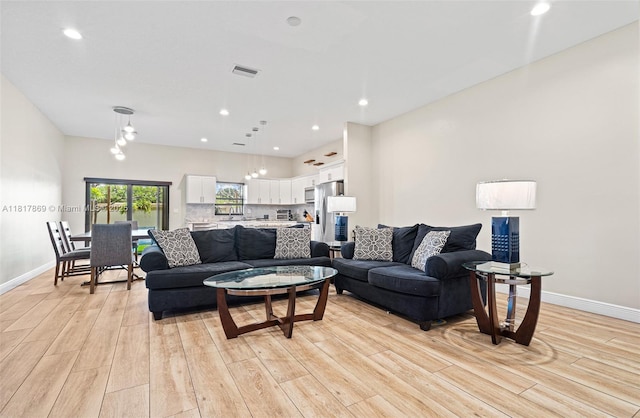 9265 NW 16th St, Pembroke Pines, FL 33024 - living area with light wood finished floors and recessed lighting