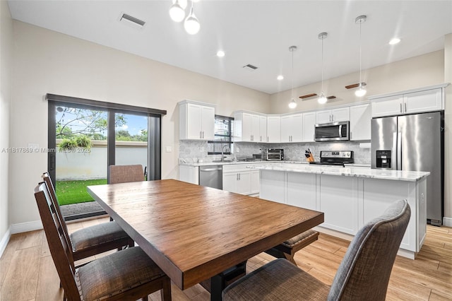 9265 NW 16th St, Pembroke Pines, FL 33024 - dining room with healthy amount of natural light, recessed lighting, and light wood-type flooring