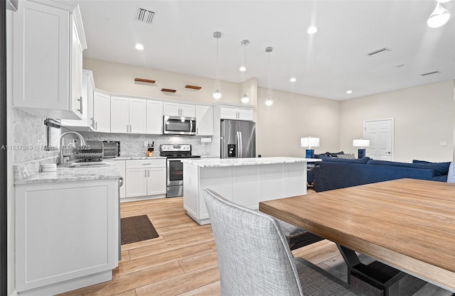 9265 NW 16th St, Pembroke Pines, FL 33024 - dining room with light wood-type flooring and recessed lighting