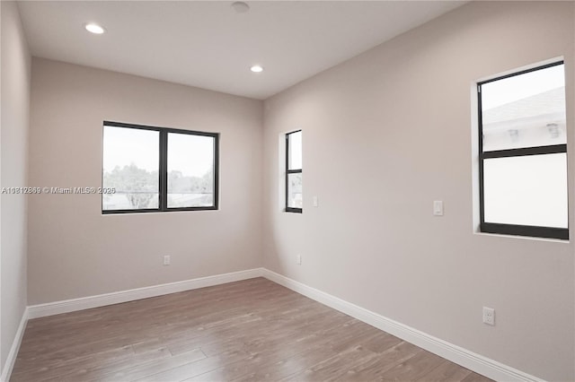 9265 NW 16th St, Pembroke Pines, FL 33024 - empty room with light wood-type flooring and recessed lighting