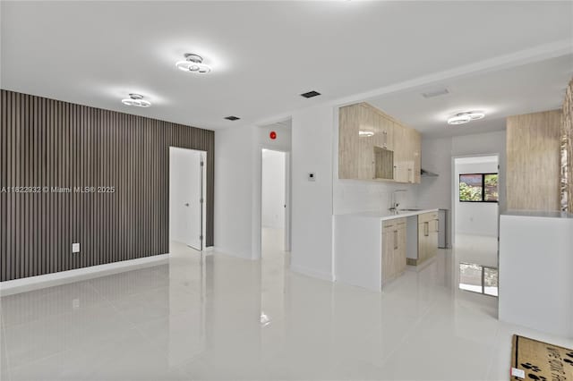 1640 NE 183rd St, North Miami Beach, FL 33179 - kitchen featuring light countertops, modern cabinets, light tile patterned floors, and light brown cabinetry