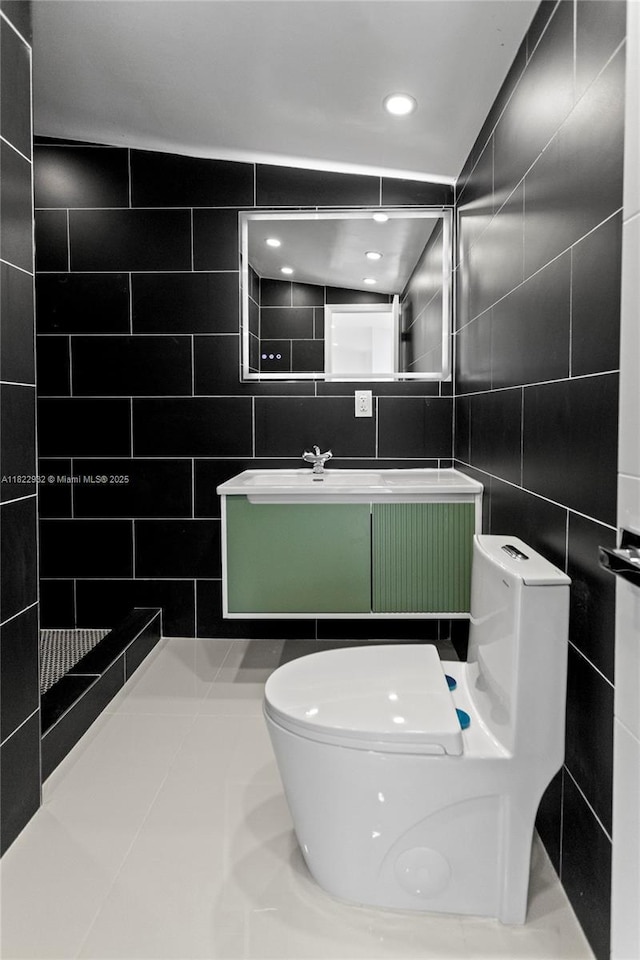 1640 NE 183rd St, North Miami Beach, FL 33179 - bathroom with tile walls, vanity, and tile patterned flooring