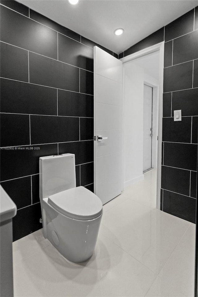 1640 NE 183rd St, North Miami Beach, FL 33179 - bathroom with tile walls, tile patterned floors, recessed lighting, and vanity
