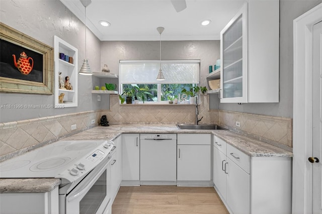 1314 SE 1st Ave, Fort Lauderdale, FL 33316 - kitchen featuring white appliances, open shelves, white cabinets, light wood-style flooring, and backsplash