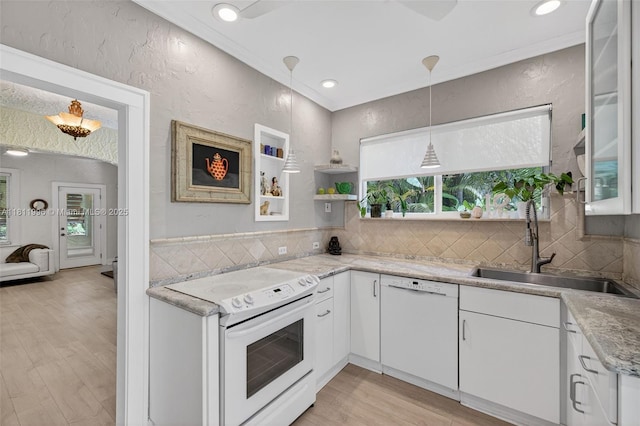 1314 SE 1st Ave, Fort Lauderdale, FL 33316 - kitchen with white appliances, white cabinets, light wood finished floors, a textured wall, and decorative backsplash