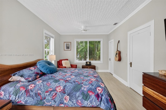 1314 SE 1st Ave, Fort Lauderdale, FL 33316 - bedroom with light wood-style flooring and ornamental molding