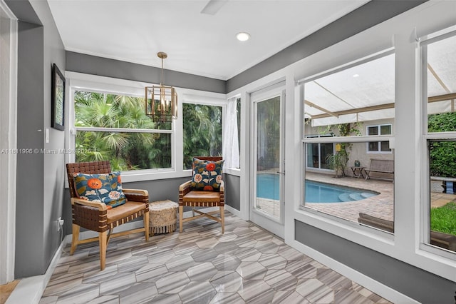 1314 SE 1st Ave, Fort Lauderdale, FL 33316 - sunroom featuring recessed lighting and a chandelier