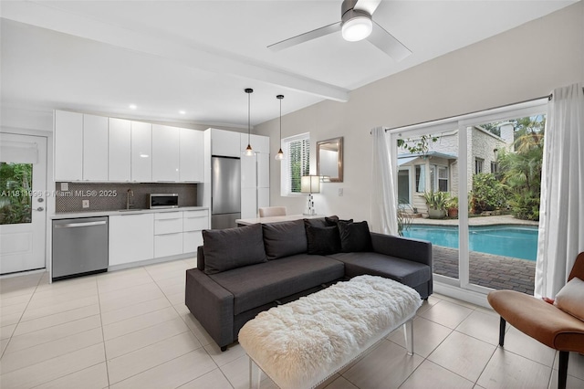1314 SE 1st Ave, Fort Lauderdale, FL 33316 - living area featuring light tile patterned flooring, healthy amount of natural light, a ceiling fan, beam ceiling, and recessed lighting
