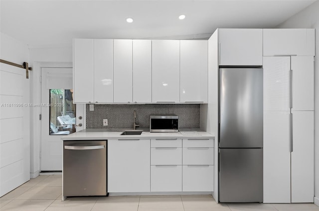 1314 SE 1st Ave, Fort Lauderdale, FL 33316 - kitchen featuring stainless steel appliances, light countertops, white cabinets, backsplash, and recessed lighting