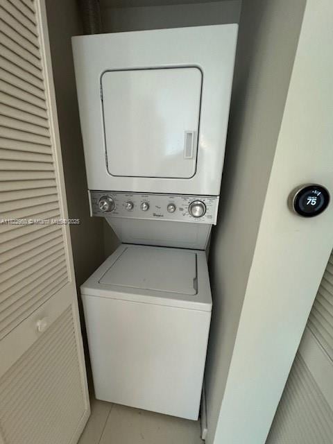 7875 NW 107th Ave Unit 410, Doral, FL 33178 - laundry area featuring estacked washer and dryer