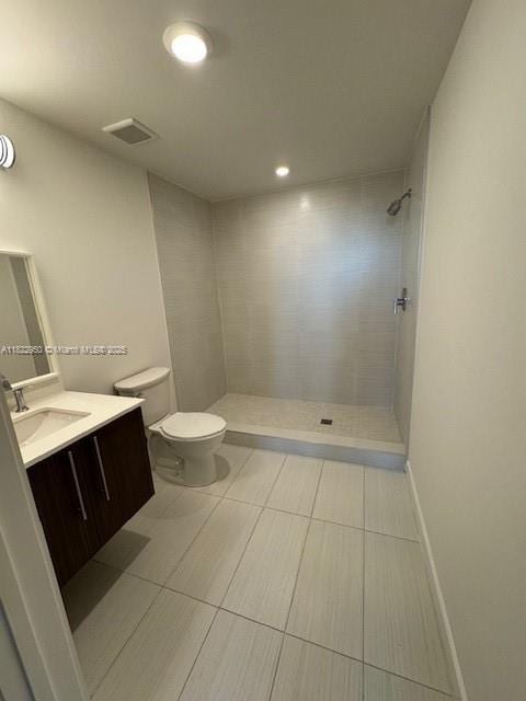 7875 NW 107th Ave Unit 410, Doral, FL 33178 - full bath with vanity, a tile shower, recessed lighting, and tile patterned flooring
