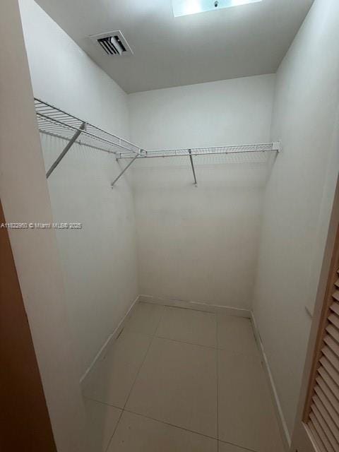 7875 NW 107th Ave Unit 410, Doral, FL 33178 - spacious closet featuring tile patterned flooring