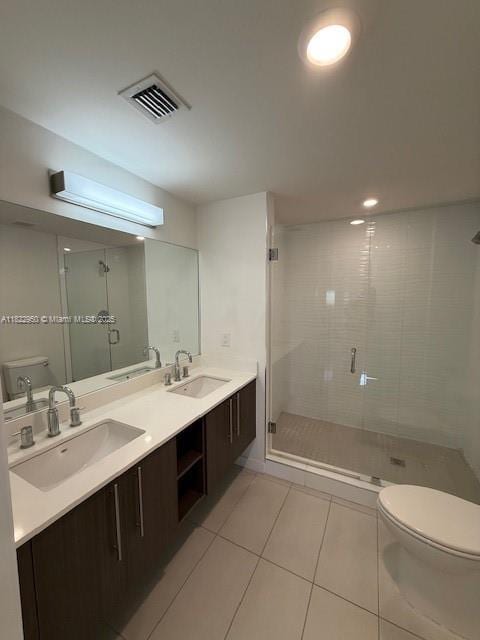 7875 NW 107th Ave Unit 410, Doral, FL 33178 - full bathroom with tile patterned floors, a shower stall, and double vanity