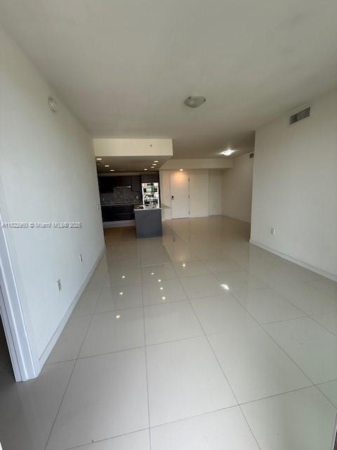 7875 NW 107th Ave Unit 410, Doral, FL 33178 - hall with light tile patterned flooring