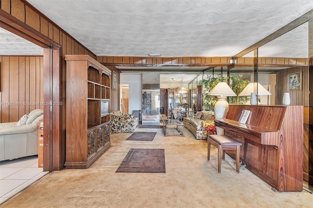 2390 Service Rd, Opa-Locka, FL 33054 - carpeted living room featuring wood walls and tile patterned flooring