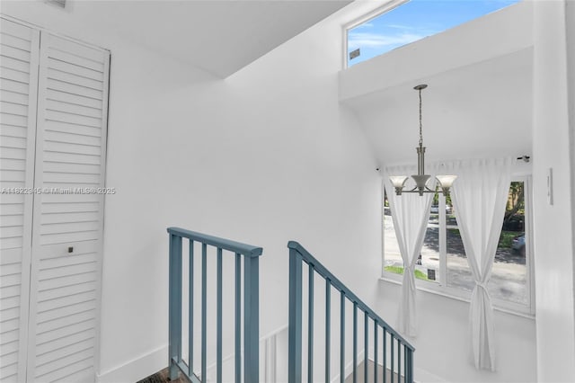 6728 SW 140th Ct, Miami, FL 33183 - stairs featuring a chandelier and baseboards