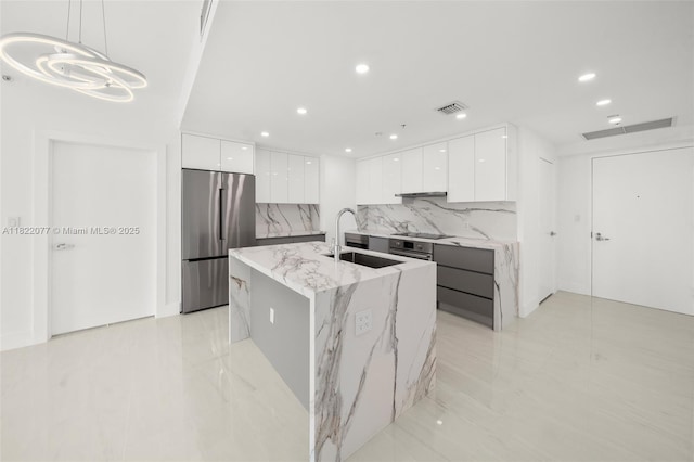 1900 N Bayshore Dr Unit 2104, Miami, FL 33132 - kitchen featuring modern cabinets, appliances with stainless steel finishes, white cabinetry, tasteful backsplash, and recessed lighting