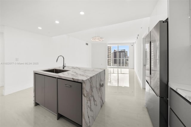 1900 N Bayshore Dr Unit 2104, Miami, FL 33132 - kitchen featuring freestanding refrigerator, an island with sink, modern cabinets, gray cabinetry, and recessed lighting