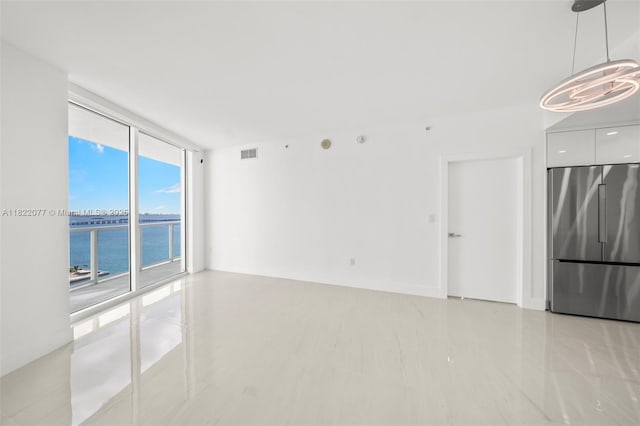 1900 N Bayshore Dr Unit 2104, Miami, FL 33132 - unfurnished room featuring a wall of windows and a water view