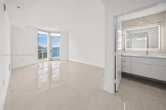 1900 N Bayshore Dr Unit 2104, Miami, FL 33132 - unfurnished room with a water view, a pendent fire sprinkler, and light tile patterned floors