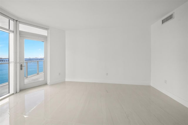 1900 N Bayshore Dr Unit 2104, Miami, FL 33132 - spare room featuring baseboards and a water view