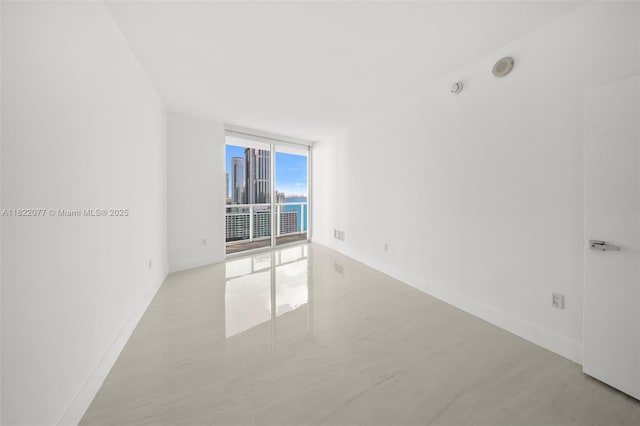 1900 N Bayshore Dr Unit 2104, Miami, FL 33132 - spare room with floor to ceiling windows and a smoke detector