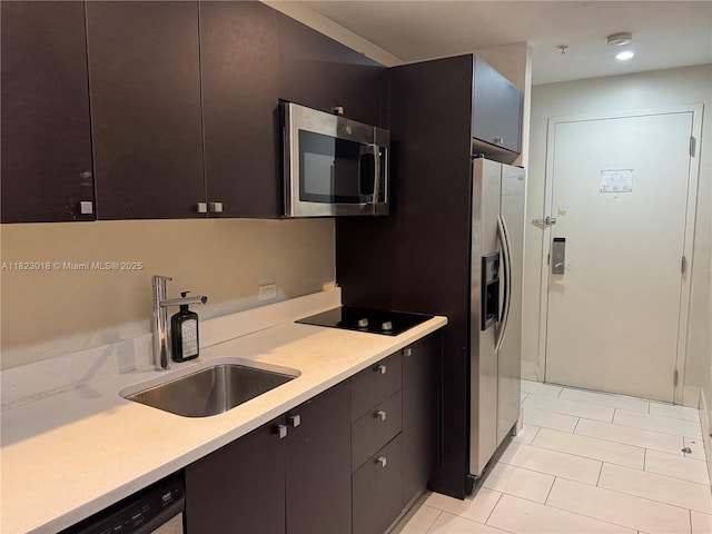 5300 NW 87th Ave Unit 1507, Doral, FL 33178 - kitchen featuring appliances with stainless steel finishes, light tile patterned floors, and light countertops