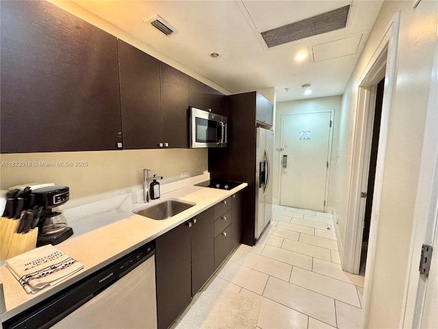 5300 NW 87th Ave Unit 1507, Doral, FL 33178 - kitchen featuring appliances with stainless steel finishes, light tile patterned floors, and light countertops