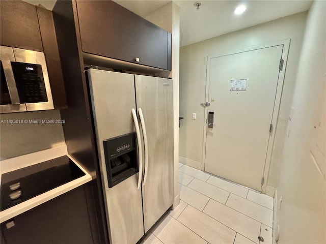 5300 NW 87th Ave Unit 1507, Doral, FL 33178 - kitchen with stainless steel appliances, light tile patterned floors, recessed lighting, and dark brown cabinets