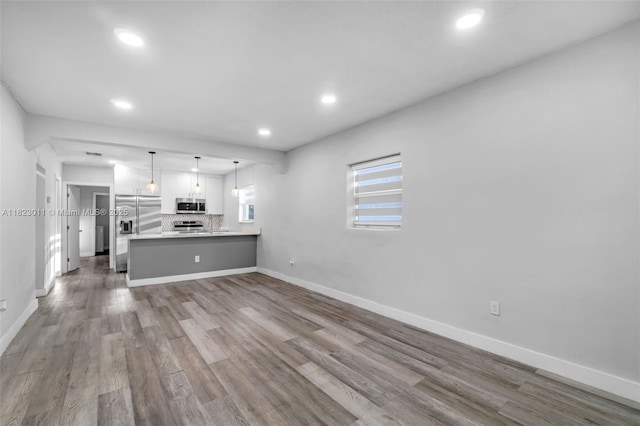 4622 SW 23rd St, West Park, FL 33023 - unfurnished living room featuring recessed lighting and wood finished floors