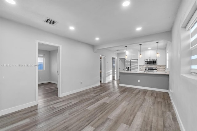 4622 SW 23rd St, West Park, FL 33023 - unfurnished living room with recessed lighting and wood finished floors