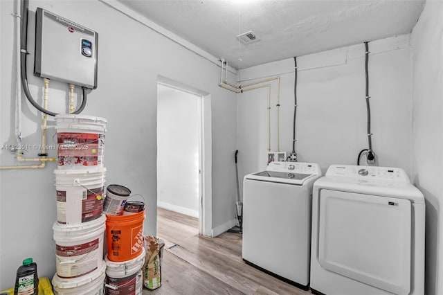 4622 SW 23rd St, West Park, FL 33023 - laundry room with washer and dryer and light wood finished floors