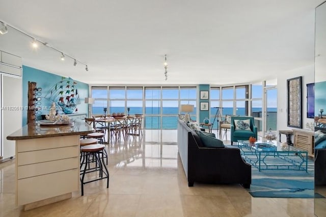 6423 Collins Ave Unit 1605, Miami Beach, FL 33141 - living room with floor to ceiling windows, track lighting, and light tile patterned flooring