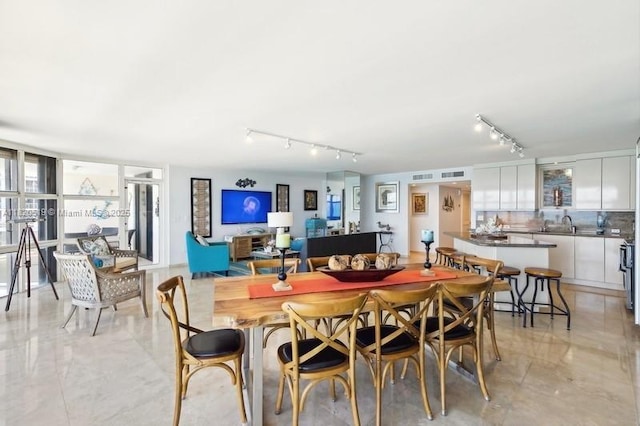 6423 Collins Ave Unit 1605, Miami Beach, FL 33141 - dining space with rail lighting and light marble finish floors