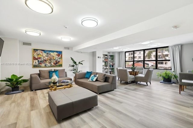 6423 Collins Ave Unit 1605, Miami Beach, FL 33141 - living area with light wood-style flooring and built in features
