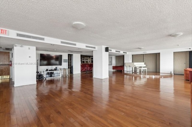 6423 Collins Ave Unit 1605, Miami Beach, FL 33141 - living area featuring wood finished floors and a textured ceiling