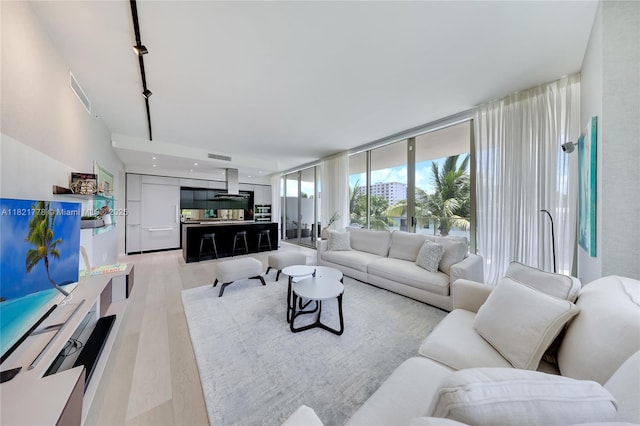 300 Collins Ave Unit 3D, Miami Beach, FL 33139 - living area featuring light wood-type flooring