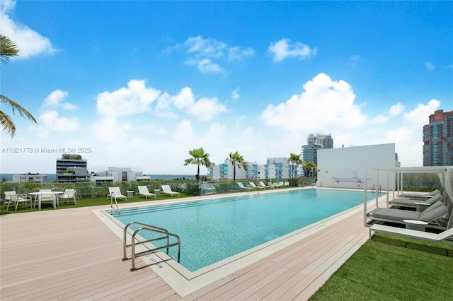 300 Collins Ave Unit 3D, Miami Beach, FL 33139 - community pool with a wooden deck and a city view