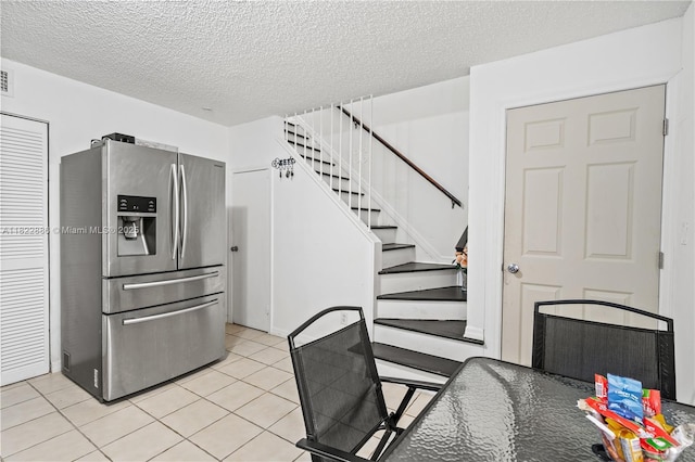 17845 SW 112th Ct, Miami, FL 33157 - kitchen featuring stainless steel refrigerator with ice dispenser, a textured ceiling, and tile patterned flooring