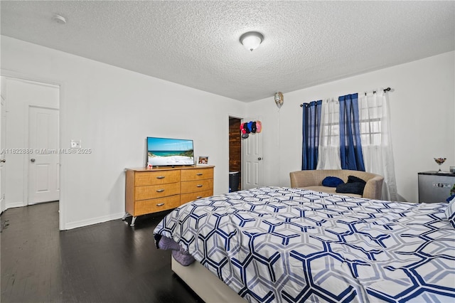17845 SW 112th Ct, Miami, FL 33157 - bedroom featuring a textured ceiling and dark wood-style flooring