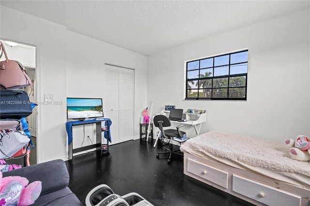 17845 SW 112th Ct, Miami, FL 33157 - bedroom featuring a closet, wood finished floors, and a textured ceiling