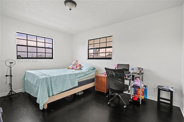 17845 SW 112th Ct, Miami, FL 33157 - bedroom featuring wood finished floors, a textured ceiling, and multiple windows