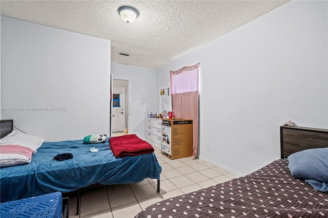 17845 SW 112th Ct, Miami, FL 33157 - bedroom featuring a textured ceiling and light tile patterned floors